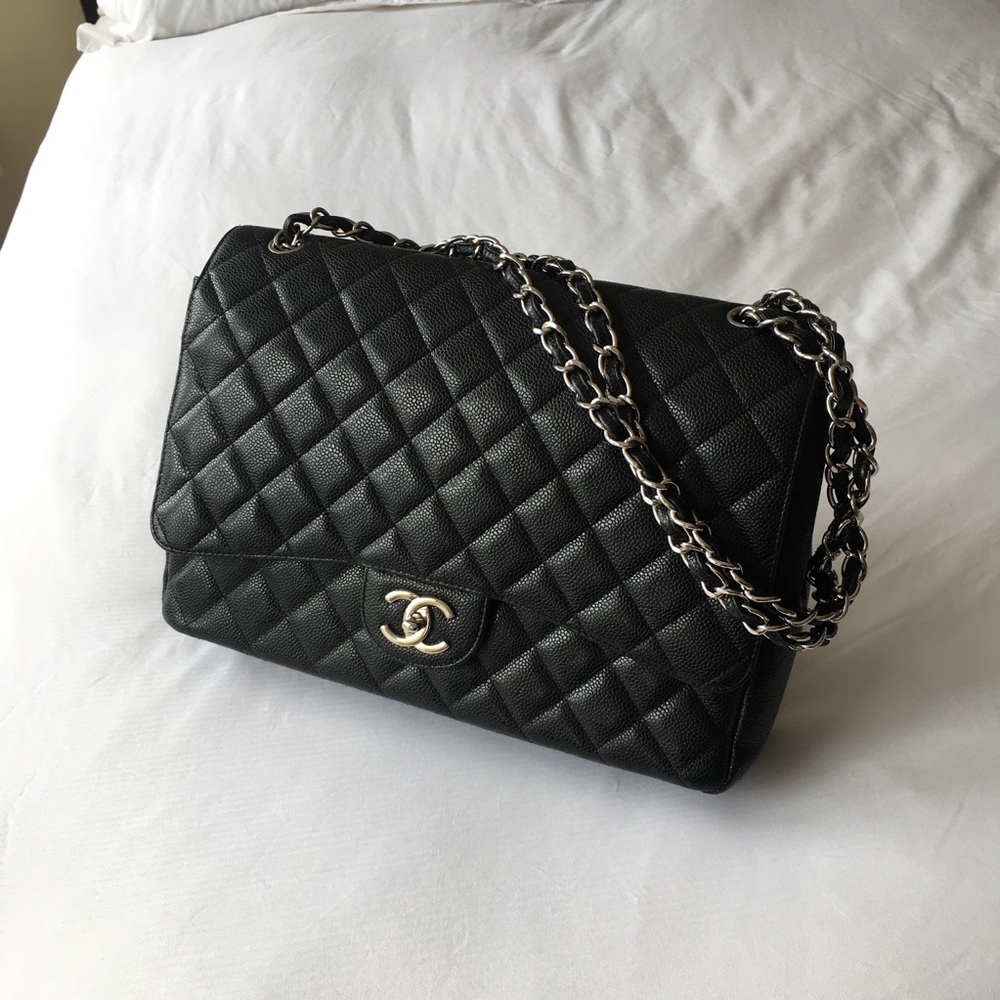CHANEL black quilted caviar bag